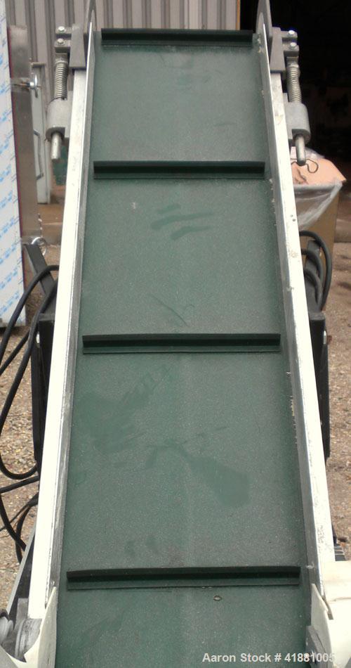 Used Crizaf Incline Belt Conveyor, Model LTCH/1-0510. 10" wide x 12" horizontal section x 40" incline section. Driven by a 1/6 hp, 1/60/115 volt, 40 rpm gear motor, ratio 42.7:1. Approximate 70" disc...