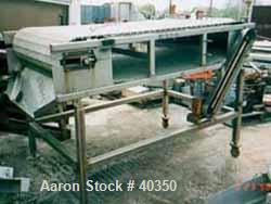Used Inline Conveyor. Plastic Interlox type belt 36" wide x 60" long. Stainless steel exterior frame. Approximate 48" belt height. Driven by a 1 hp, 50/100 volt, 1750 rpm motor. Unit mounted on caste...