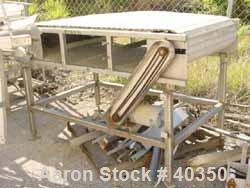Used Inline Conveyor. Plastic Interlox type belt 36" wide x 60" long. Stainless steel exterior frame. Approximate 48" belt height. Driven by a 1 hp, 50/100 volt, 1750 rpm motor. Unit mounted on caste...