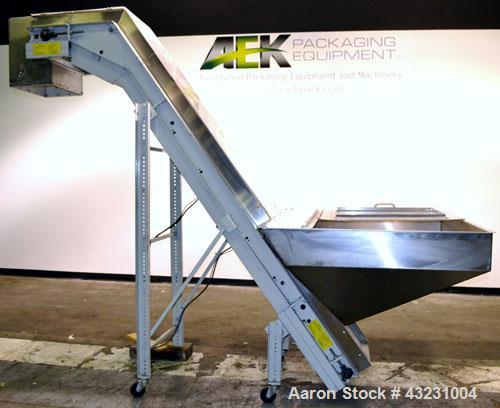 Used Bulk Elevator Feeder, Stainless Steel. Approximate 10" widex 84’’ long pleated belt, approximate 80" discharge height. 56’’ x 42’’ x 24’’ Deep bulk supply hopper. Driven by an approximate 1/2 hp...