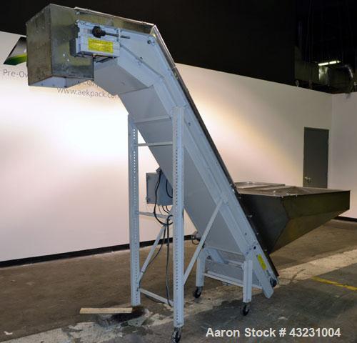 Used Bulk Elevator Feeder, Stainless Steel. Approximate 10" widex 84’’ long pleated belt, approximate 80" discharge height. 56’’ x 42’’ x 24’’ Deep bulk supply hopper. Driven by an approximate 1/2 hp...