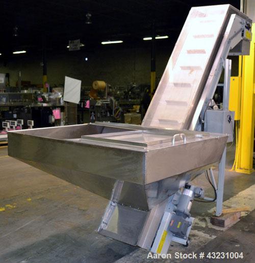 Used Bulk Elevator Feeder, Stainless Steel. Approximate 10" widex 84’’ long pleated belt, approximate 80" discharge height. 56’’ x 42’’ x 24’’ Deep bulk supply hopper. Driven by an approximate 1/2 hp...