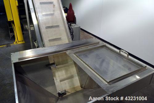 Used Bulk Elevator Feeder, Stainless Steel. Approximate 10" widex 84’’ long pleated belt, approximate 80" discharge height. 56’’ x 42’’ x 24’’ Deep bulk supply hopper. Driven by an approximate 1/2 hp...
