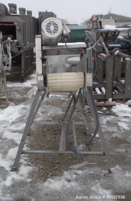 Used Incline Belt Conveyor. 12" wide x 84" long cleated rubber belt. Driven by a 1 hp, 3/60/208-230/460 volt, 1740 rpm gear motor, ratio 50 to 1. Mounted on a stainless steel frame.