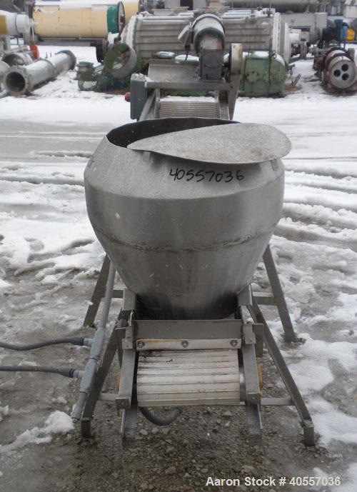 Used Incline Belt Conveyor. 12" wide x 84" long cleated rubber belt. Driven by a 1 hp, 3/60/208-230/460 volt, 1740 rpm gear motor, ratio 50 to 1. Mounted on a stainless steel frame.