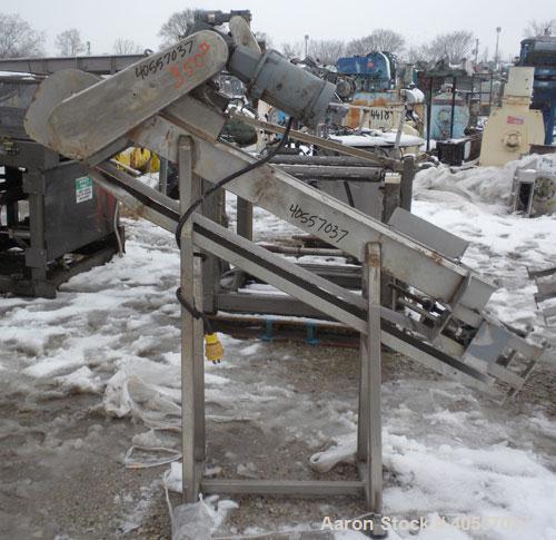 Used Incline Belt Conveyor. 6" wide x 56" long cleated rubber belt. Driven by a 3/4 hp, 3/60/208-230/460 volt, 1725 rpm gear motor, no ratio. Mounted on a stainless steel frame.
