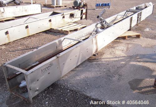 Used- Approximately 14 inch wide x 34 foot long drag chain conveyor, stainless steel housing with carbon steel chain and som...