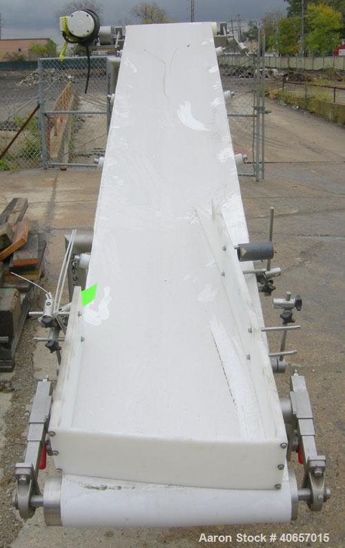 Used Inclined Belt Conveyor, 23 1/2" wide x 152" long rubber belt. Driven by a 1 hp, 3/60/208-230/460 volt, 1725 rpm gearmotor, ratio 10 to 1. Mounted on a stainless steel frame with casters, approxi...