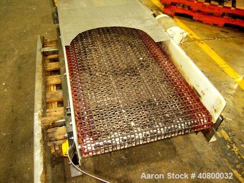 Used Belt Conveyor. Plastic belt 24" wide x 53" long. Stainless steel frame. Driven by a 1 hp, 3/60/575 volt, 1725 rpm gear motor.