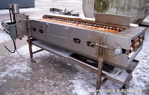 Used Motorized Roller Conveyor. 24" wide x 90" long. Driven by a 1/2hp, 3/60/575 volt, 1740 rpm gear motor. Includes a bottom drip pan, mounted on a 304 stainless steel frame.