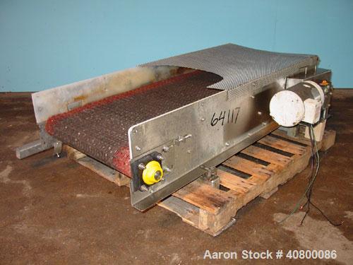 Used Belt Conveyor. Plastic belt 24" wide x 53" long. Stainless steel frame. Driven by a 1 hp, 3/60/575 volt, 1725 rpm gear motor.