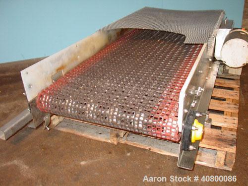 Used Belt Conveyor. Plastic belt 24" wide x 53" long. Stainless steel frame. Driven by a 1 hp, 3/60/575 volt, 1725 rpm gear motor.