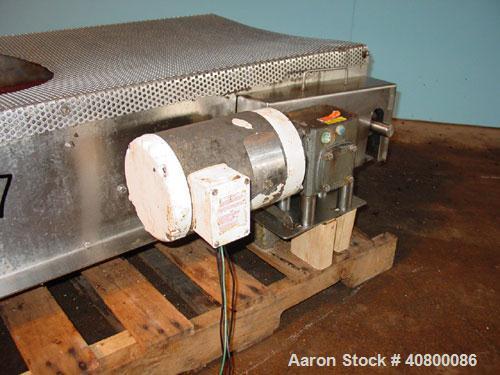 Used Belt Conveyor. Plastic belt 24" wide x 53" long. Stainless steel frame. Driven by a 1 hp, 3/60/575 volt, 1725 rpm gear motor.