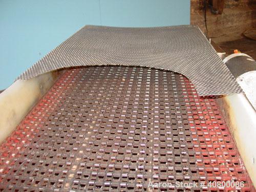 Used Belt Conveyor. Plastic belt 24" wide x 53" long. Stainless steel frame. Driven by a 1 hp, 3/60/575 volt, 1725 rpm gear motor.