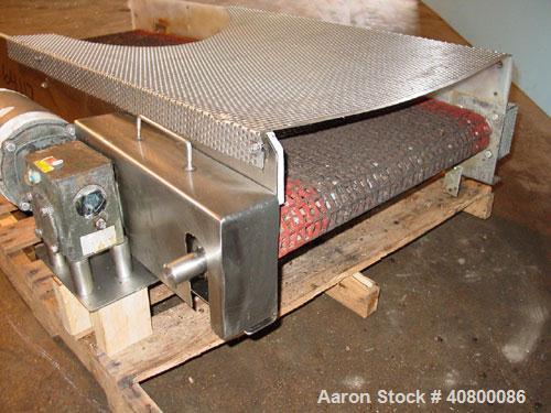 Used Belt Conveyor. Plastic belt 24" wide x 53" long. Stainless steel frame. Driven by a 1 hp, 3/60/575 volt, 1725 rpm gear motor.