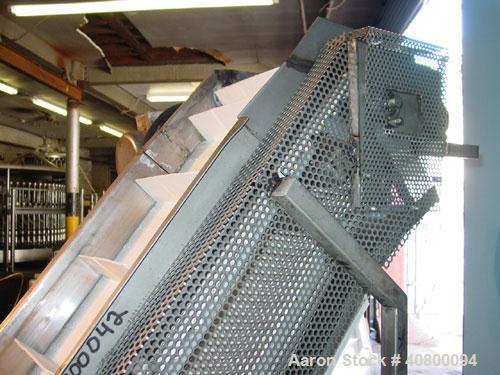 Used Inclined "S" Shaped Conveyor, 304 stainless steel frame. 14" wide x 3" tall cleated plastic belt, 24" long bottom infeed section, 72" long incline section, 12" long top discharge section, approx...