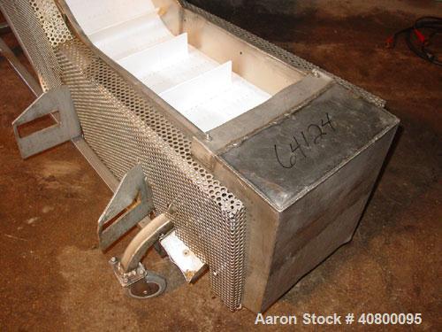 Used Inclined "S" Shaped Conveyor, 304 stainless steel frame. 12" wide x 3" tall cleated plastic belt, 24" long bottom infeed section, 72" long incline section, 12" long top discharge section, approx...
