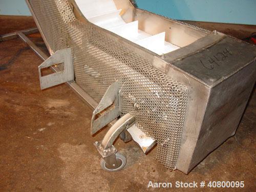 Used Inclined "S" Shaped Conveyor, 304 stainless steel frame. 12" wide x 3" tall cleated plastic belt, 24" long bottom infeed section, 72" long incline section, 12" long top discharge section, approx...