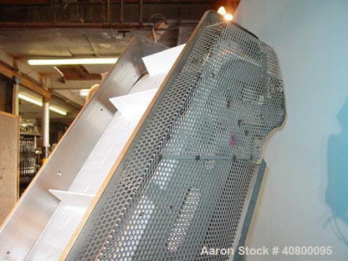 Used Inclined "S" Shaped Conveyor, 304 stainless steel frame. 12" wide x 3" tall cleated plastic belt, 24" long bottom infeed section, 72" long incline section, 12" long top discharge section, approx...