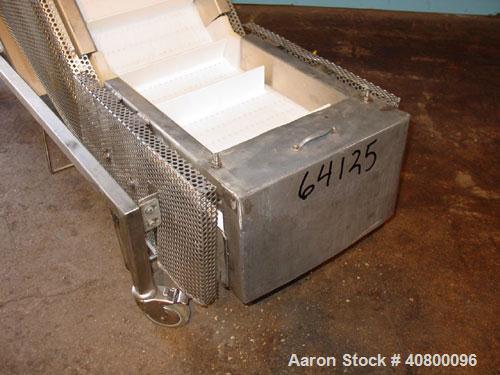 Used Trio-Pac Inclined "S" Shaped Conveyor, 304 stainless steel frame. 14" wide x 3" tall cleated plastic belt, 24" long bottom infeed section, 72" long incline section, 12" long top discharge sectio...