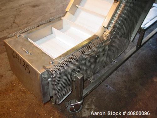 Used Trio-Pac Inclined "S" Shaped Conveyor, 304 stainless steel frame. 14" wide x 3" tall cleated plastic belt, 24" long bottom infeed section, 72" long incline section, 12" long top discharge sectio...