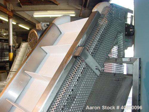 Used Trio-Pac Inclined "S" Shaped Conveyor, 304 stainless steel frame. 14" wide x 3" tall cleated plastic belt, 24" long bottom infeed section, 72" long incline section, 12" long top discharge sectio...