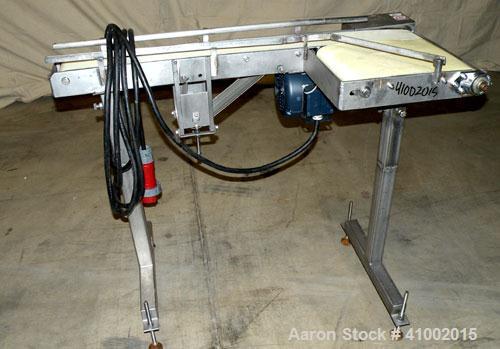 Used Belt Conveyor, Transfer Type. 4" wide x 42" long section, and a 10 3/4" wide x 14" long transfer section. Driven by a 3/4 HP, 3/60/230/460 Volt, 1750 RPM gearmotor, ratio 20 to 1. Mounted on a s...