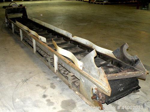 Used Belt Conveyor. Rubber belt 23" wide x 216" long. 11" long x 2" deep pockets. Driven by a 1 hp, 3/60/208-230/460 volt, 1725 rpm motor with reducer, ratio 20 to 1. Mounted on a 304 stainless steel...