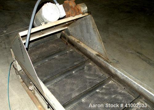 Used Belt Conveyor. Rubber belt 23" wide x 216" long. 11" long x 2" deep pockets. Driven by a 1 hp, 3/60/208-230/460 volt, 1725 rpm motor with reducer, ratio 20 to 1. Mounted on a 304 stainless steel...