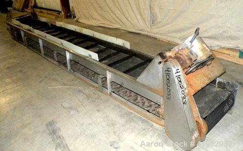 Used Belt Conveyor. Rubber belt 23" wide x 216" long. 11" long x 2" deep pockets. Driven by a 1 hp, 3/60/208-230/460 volt, 1725 rpm motor with reducer, ratio 20 to 1. Mounted on a 304 stainless steel...