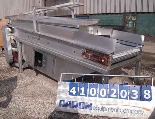 Used Inclined Cooling Belt Conveyor, 304 stainless steel. 36" wide x 102" long wire mesh stainless steel belt. Driven by a 3/4 hp, 90 volt, 1750 rpm DC gearmotor. Mounted on stainless steel frame.