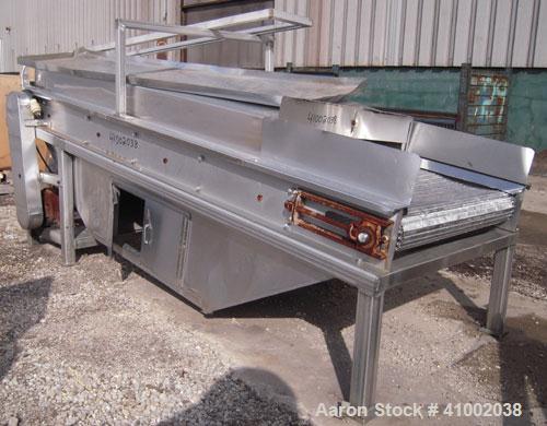 Used Inclined Cooling Belt Conveyor, 304 stainless steel. 36" wide x 102" long wire mesh stainless steel belt. Driven by a 3/4 hp, 90 volt, 1750 rpm DC gearmotor. Mounted on stainless steel frame.