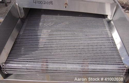Used Inclined Cooling Belt Conveyor, 304 stainless steel. 36" wide x 102" long wire mesh stainless steel belt. Driven by a 3/4 hp, 90 volt, 1750 rpm DC gearmotor. Mounted on stainless steel frame.