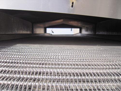 Used Inclined Cooling Belt Conveyor, 304 stainless steel. 36" wide x 102" long wire mesh stainless steel belt. Driven by a 3/4 hp, 90 volt, 1750 rpm DC gearmotor. Mounted on stainless steel frame.