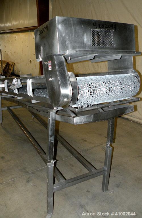 Used Ron Bichel Inclined Plastic Belt Conveyor. 24" wide x 116" long with 11 1/2" wide x 1/2" tall pockets. Driven by a 3/4 hp, 3/60/208-230/460 volt, 1750 rpm motor thru a reducer, ratio 20 to 1. 54...