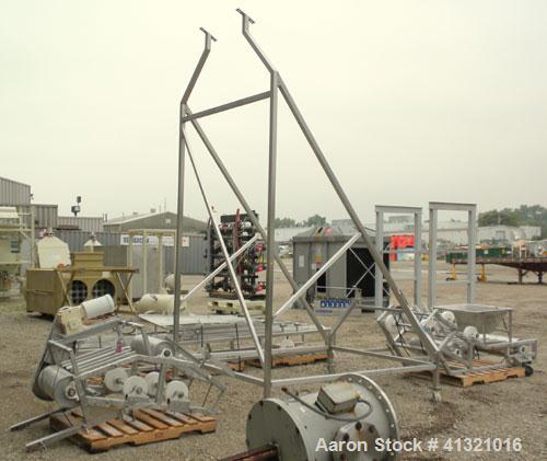 Used Inclined "S" Shaped Belt Conveyor. Approximate 24" wide rubber belt with 17" wide x 10" long x 3" deep pockets. Approximate 48" long bottom section with 27" x 27" feed hopper x 156" long incline...
