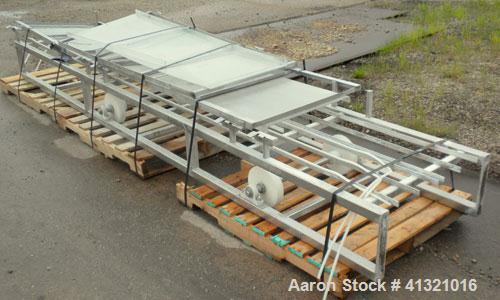 Used Inclined "S" Shaped Belt Conveyor. Approximate 24" wide rubber belt with 17" wide x 10" long x 3" deep pockets. Approximate 48" long bottom section with 27" x 27" feed hopper x 156" long incline...