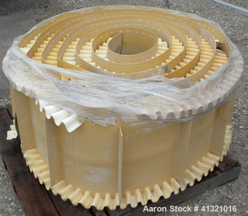 Used Inclined "S" Shaped Belt Conveyor. Approximate 24" wide rubber belt with 17" wide x 10" long x 3" deep pockets. Approximate 48" long bottom section with 27" x 27" feed hopper x 156" long incline...