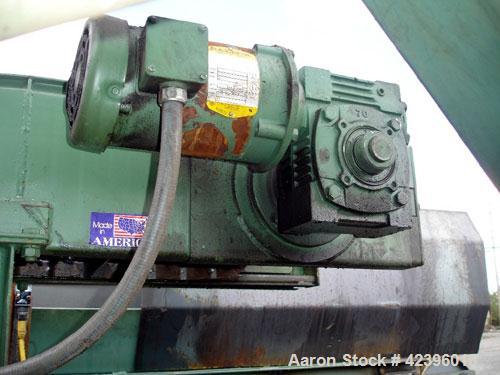 Used Transcon Z Style Metal Cleated Belt Conveyor. 12" Wide x 8' long flat section, 8.5' long inclined section, 19" long flat section, approximate 74" high discharge height. Driven by a 0.75 hp, 230/...