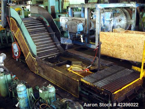 Used Z Style Metal Cleated Belt Conveyor. 48" Wide x 10' long flat section, 7' long inclined section, 4 long flat section, approximate 74" high discharge height. Approximate 23' overall length. Drive...