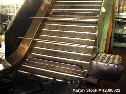 Used Z Style Metal Cleated Belt Conveyor. 48" Wide x 10' long flat section, 7' long inclined section, 4 long flat section, approximate 74" high discharge height. Approximate 23' overall length. Drive...