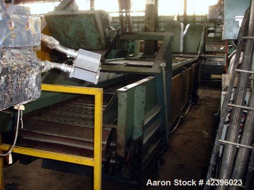 Used Z Style Metal Cleated Belt Conveyor. 36" Wide x 20' long flat section, 11' long inclined section, approximate 84" high discharge height. 18’’ Tall side rails, approximate 32’ overall length. Dri...