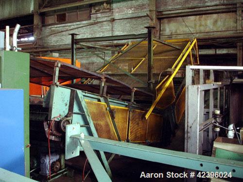 Used L Style Metal Cleated Belt Conveyor. 84" Wide x 9' long flat section, 14' long inclined section, approximate 144" high discharge height. 18’’ Tall side rails, approximate 32’ overall length. Dri...