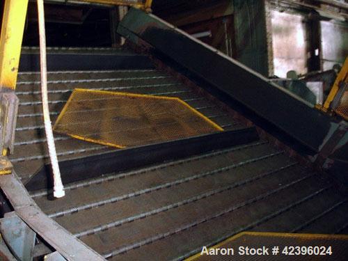 Used L Style Metal Cleated Belt Conveyor. 84" Wide x 9' long flat section, 14' long inclined section, approximate 144" high discharge height. 18’’ Tall side rails, approximate 32’ overall length. Dri...