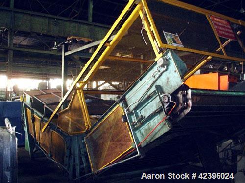 Used L Style Metal Cleated Belt Conveyor. 84" Wide x 9' long flat section, 14' long inclined section, approximate 144" high discharge height. 18’’ Tall side rails, approximate 32’ overall length. Dri...