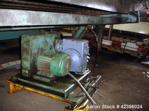 Used L Style Metal Cleated Belt Conveyor. 84" Wide x 9' long flat section, 14' long inclined section, approximate 144" high discharge height. 18’’ Tall side rails, approximate 32’ overall length. Dri...