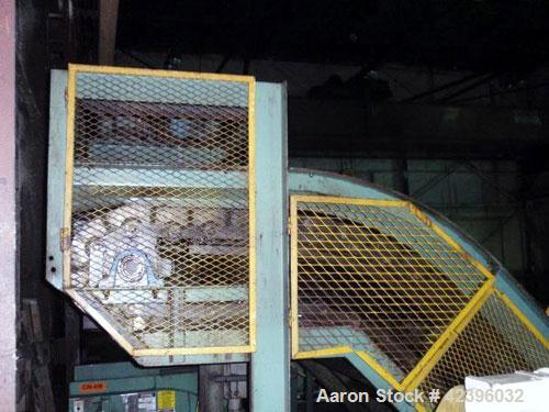 Used Z Style Metal Cleated Belt Conveyor. 46" Wide x 9' long flat section, 7' long inclined section, 4’ flat section. Approximate 84" high discharge height. With motor.