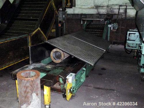 Used Z Style Metal Cleated Belt Conveyor. 28" Wide x 7' long flat section, 3' long inclined section, 3’ flat section. Approximate 40" high discharge height. With motor.