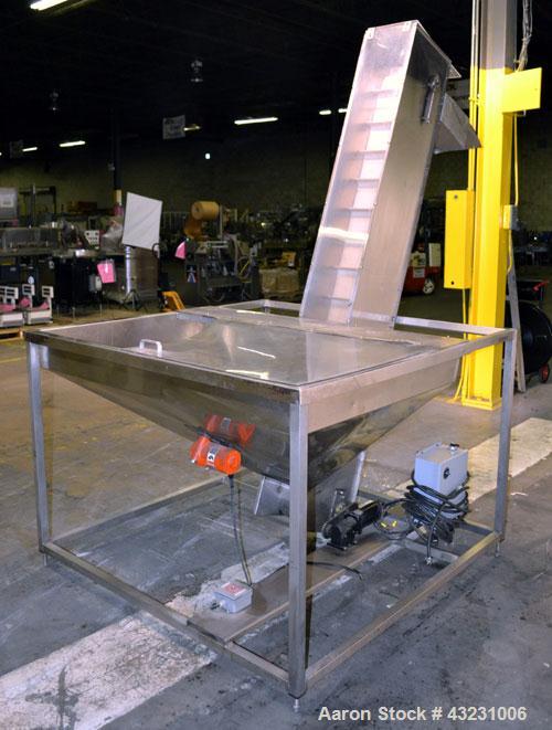 Used Bulk Elevator Feeder, Stainless Steel. Approximate 10" wide x 84 long pleated belt, approximate 80" discharge height. 56 x 42 x 24 Deep bulk supply hopper. Driven by a 1/4 hp, 90 volt DC gear mo...