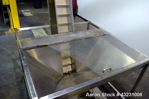 Used Bulk Elevator Feeder, Stainless Steel. Approximate 10" wide x 84 long pleated belt, approximate 80" discharge height. 56 x 42 x 24 Deep bulk supply hopper. Driven by a 1/4 hp, 90 volt DC gear mo...